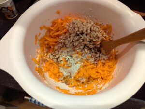 Batter with carrot and nuts on top