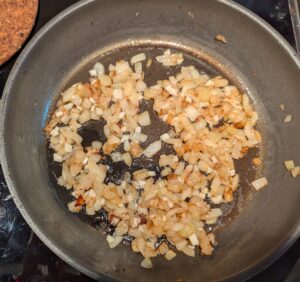 The finished fried onion and garlic in the pan.