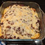 A finished pan of cheese-topped enchiladas.