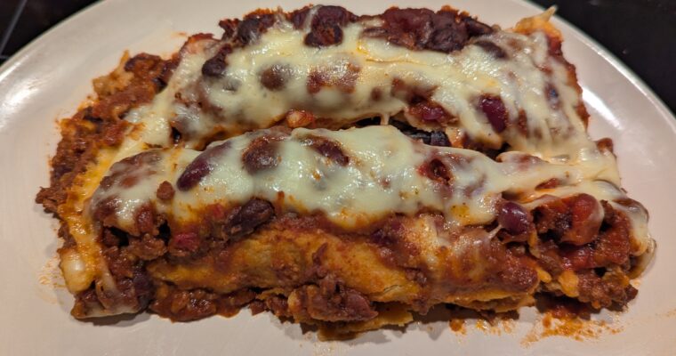 Leftover chili-smothered enchiladas