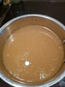 The finished pot of broth, showing where it came up to on the volume lines inside