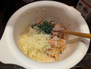 Getting ready to fold the cheese and chives into the batter.