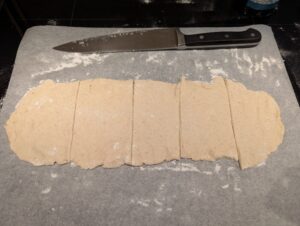 Dough rectangle rolled out fairly thin and cut into five strips