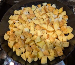Chopped potatoes and onion just added into the pan