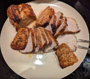 A plate of juicy sliced pork tenderloin