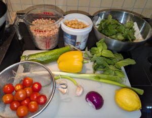 Main ingredients with the vegetables, herbs, grain and beans laid out