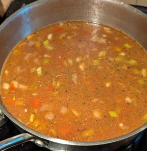 Seasoned broth in pan