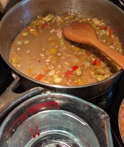 Small portion of the water added to deglaze the pan