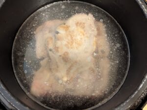 Water over pork in the pot