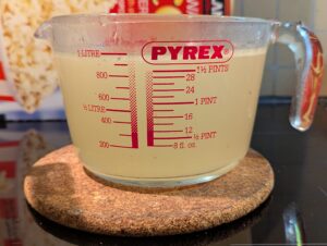 A liter Pyrex measuring cup of pork broth
