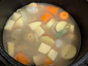 The vegetables covered with seasoned broth