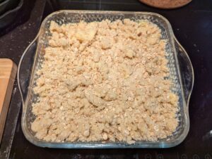 Pan topped with the crumble and waiting for the oven