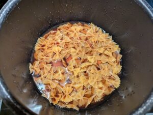 Liquid just barely coming to the top of the pasta