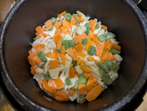 Cabbage and frozen veggies layered on