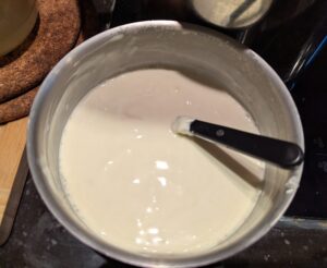 Small pan of tempered sour cream mixture ready for the soup pot.