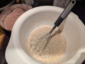Mixing bowl with the liquid mixture, looking frothy on top