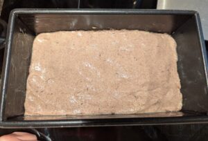 Smoothed dough in pan