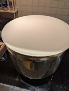 The mixing bowl covered by a plate