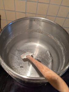 The mixing bowl shows sticky film where the dough was in it, but nothing more